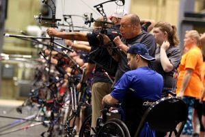 U.S. Special Operations Command Veteran Israel Del Toro, Jr., a Joliet, Ill., native, uses his teeth to draw the arrow on his compound bow at the 2016 DoD Warrior Games at the U.S. Military Academy at West Point, N.Y. The Warrior Games is a Paralympic-style adaptive sports competition for wounded, ill and injured Service members and veterans. (U.S. Army photo by Sgt. Joshua Brownlee/Released)