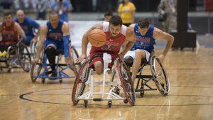 Marine Corps veteran Lance Corp. Matthew Grashen chases down a loose ball against Team Air Force in preliminary wheelchair basketball competition during the 2017 Department of Defense (DoD) Warrior Games in Chicago, Ill., June 30, 2017. The DoD Warrior Games are an annual event allowing wounded, ill and injured service members and veterans to compete in Paralympic-style sports including archery, cycling, field, shooting, sitting volleyball, swimming, track and wheelchair basketball. 
