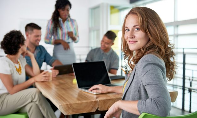 Image of a succesful casual business woman using laptop during