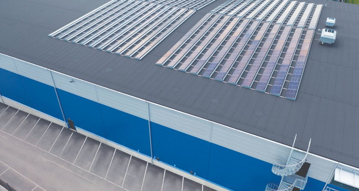 Solar panels on roof of indoor sports facility