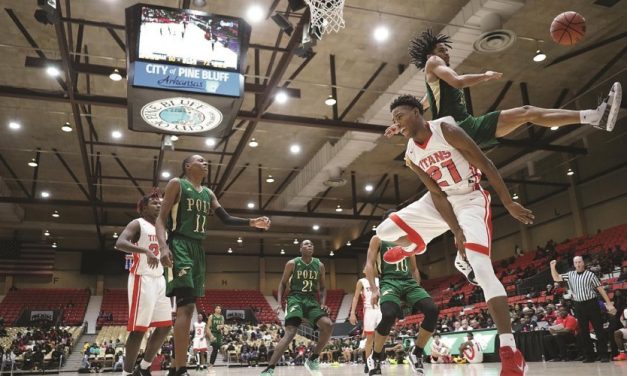 One player blocks another’s layup attempt at the Pine Bluff Convention Center in Pine Bluff, Arkansas.