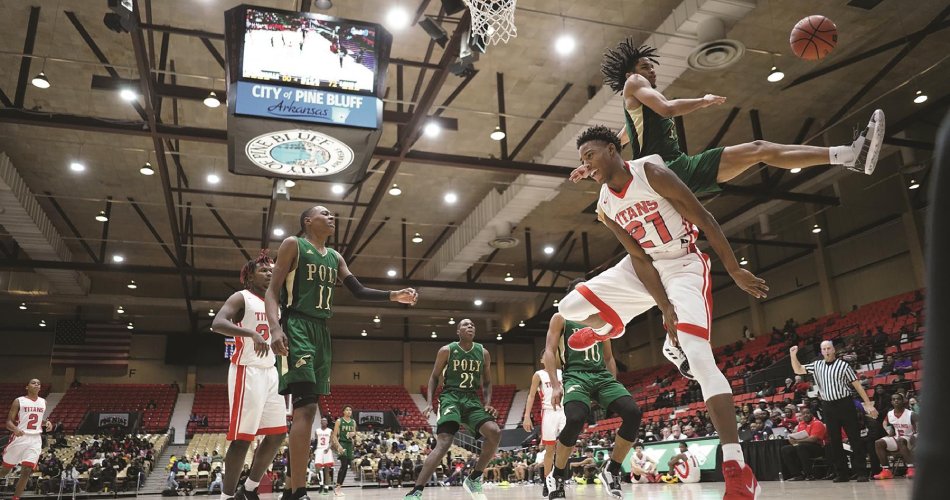 One player blocks another’s layup attempt at the Pine Bluff Convention Center in Pine Bluff, Arkansas.