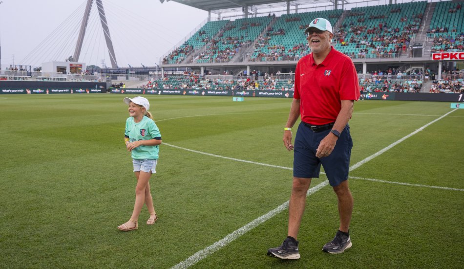 Jim Rowland walks onto the KC Current's home pitch at CPKC Stadium in Kansas City, MO.